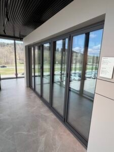 porte accordéon aluminium triple vitrage Limoges baie vitrée grande ouverture moderne